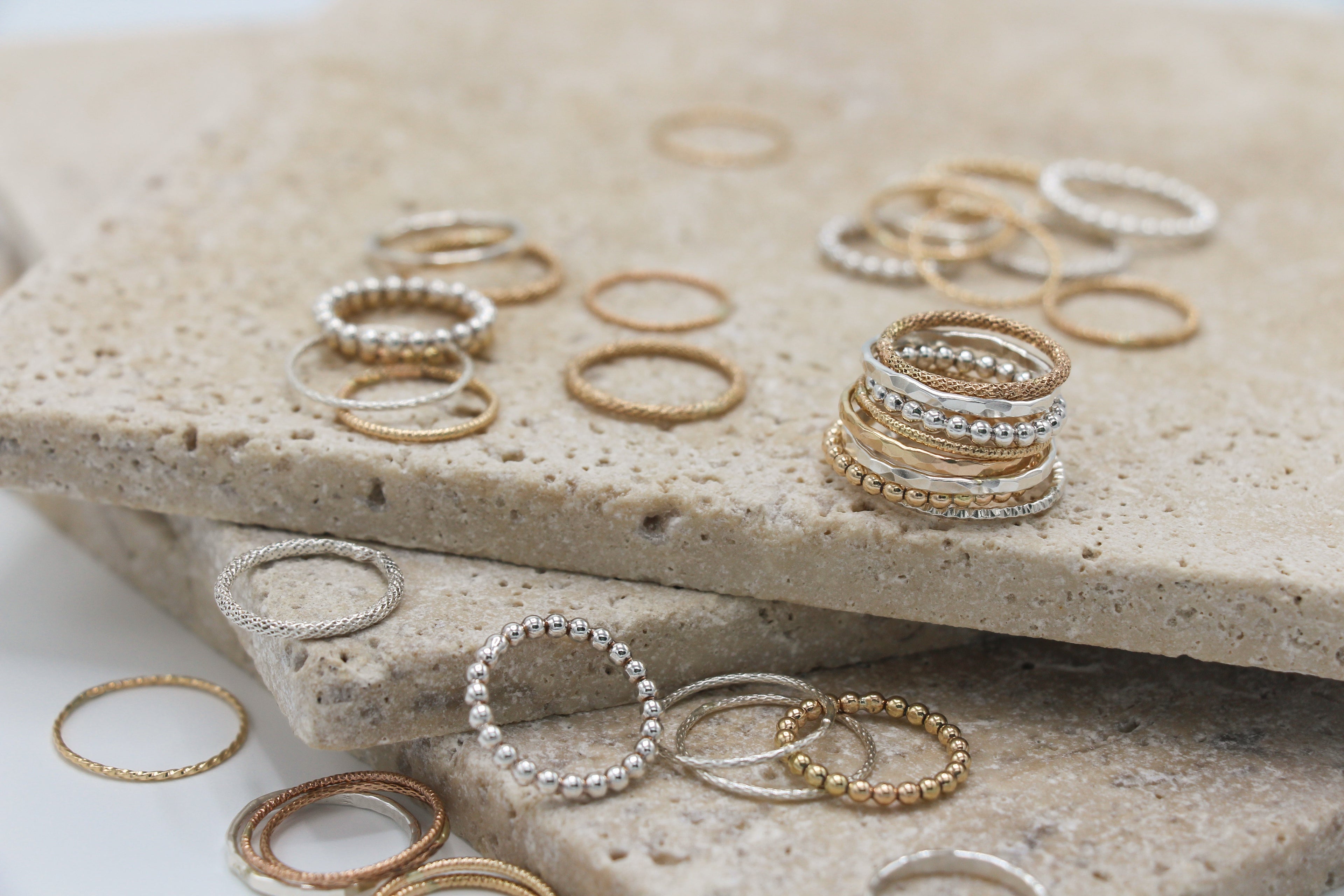 Different texture and designs of stacker rings in gold and silver