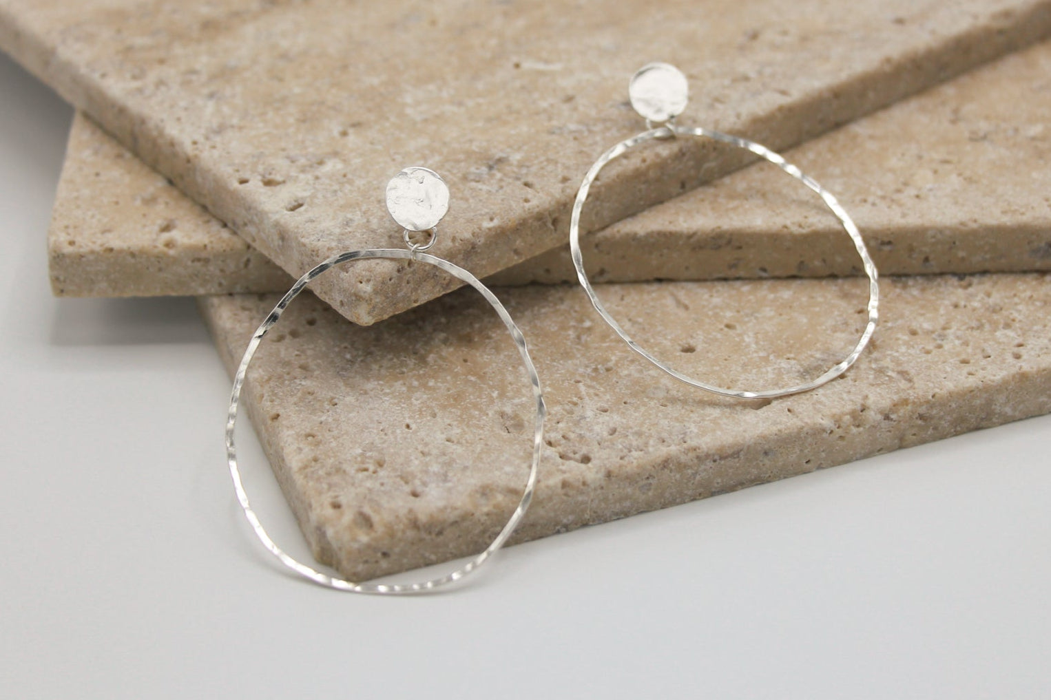 Sterling silver handmade geometric earrings with a hammered finish